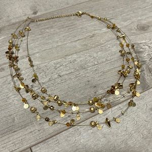 Gold necklace with orange beads
